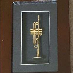 Gold Trumpet Figurine in a Wood Frame